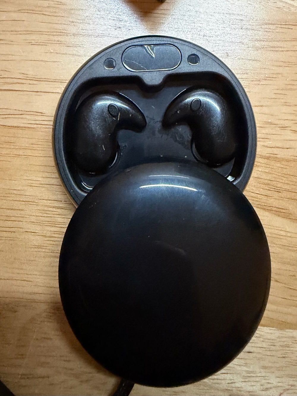 Black True Wireless Earbuds with Round Charging Case